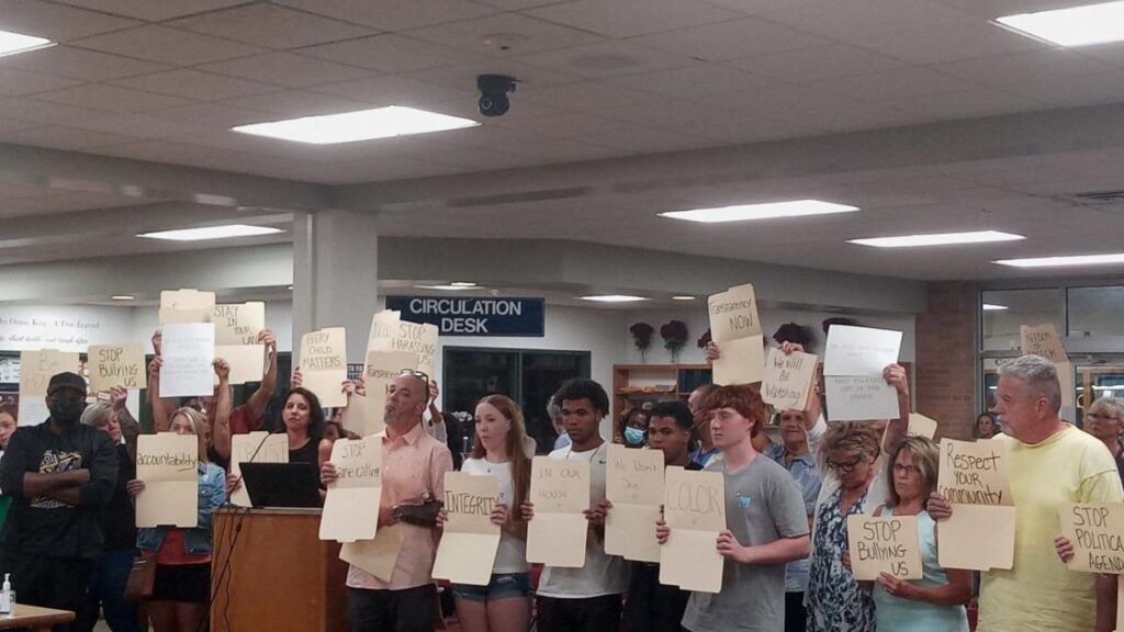 Auburn school board meeting goes from silent protest to shouting match