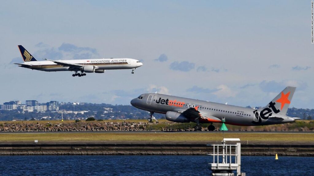 Australian government halves arrival cap, leaving thousands stranded as air fares skyrocket